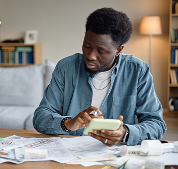 man using a calculator