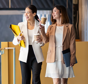 two professional women walking and talking
