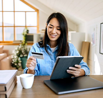 woman looking at her credit card