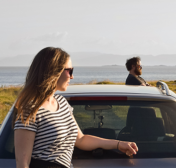 people standing by car