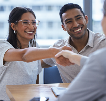 couple talking business and shaking hands