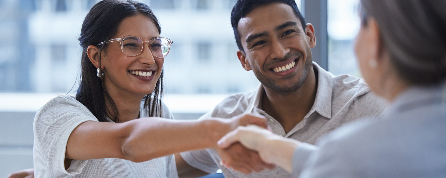 couple talking business and shaking hands