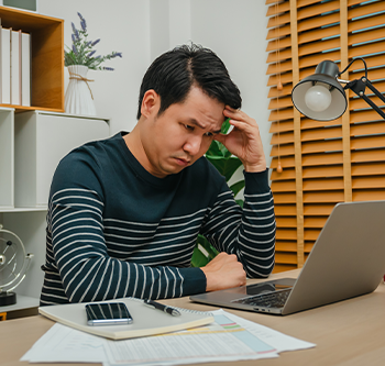 stressed out man on computer