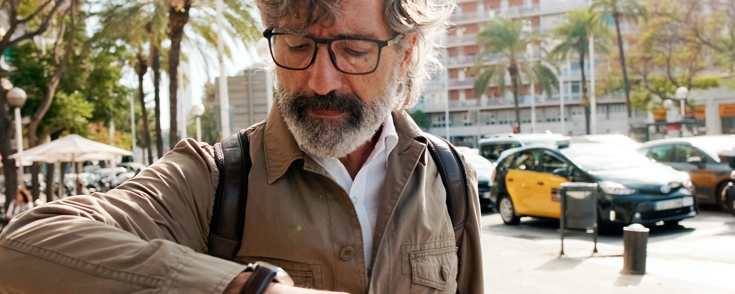 man looking at his watch