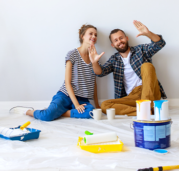 couple painting their house