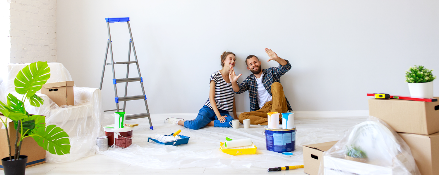 couple painting their house