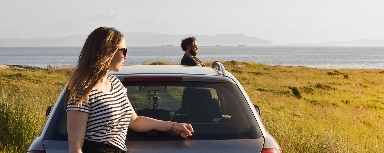 people standing by car