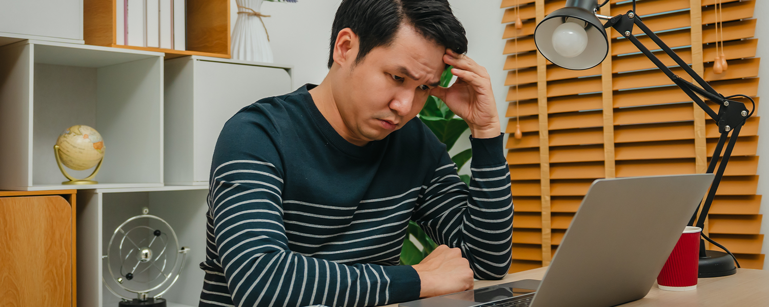 stressed out man on computer
