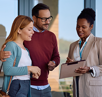 realtor talking to couple