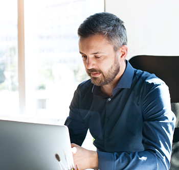 man on office computer