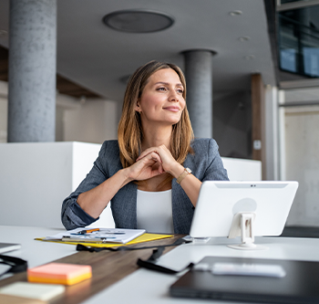 woman at desk with computer