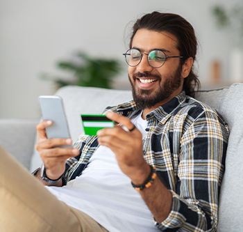 man doing some online shopping on his phone