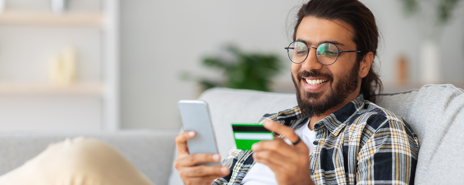 man doing some online shopping on his phone