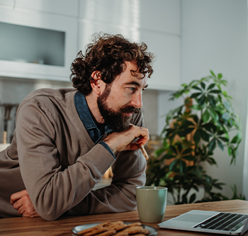 man looking at his computer