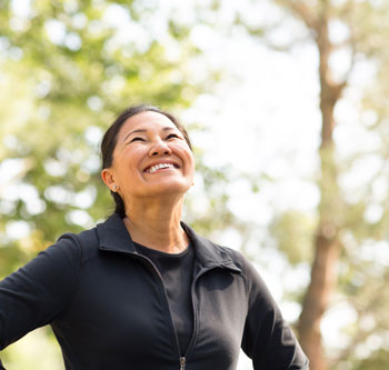 Woman in black jacket smiling