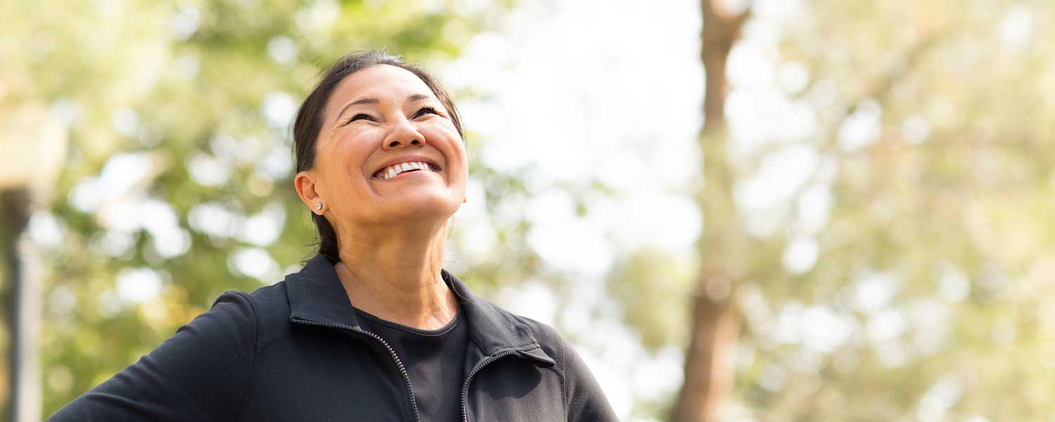 Woman in black jacket smiling