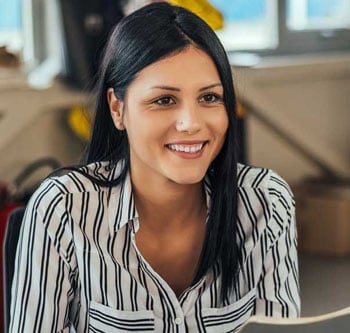 Woman smiling and holding papers