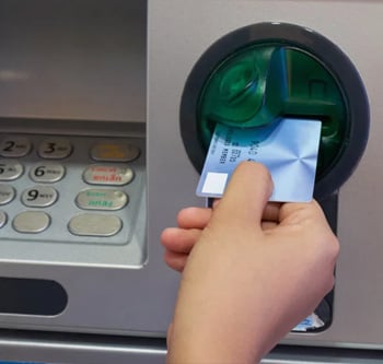 Woman using an ATM