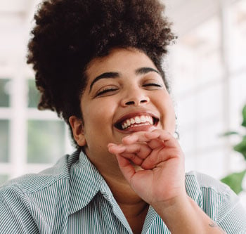 Woman leaning on her hand and smiling