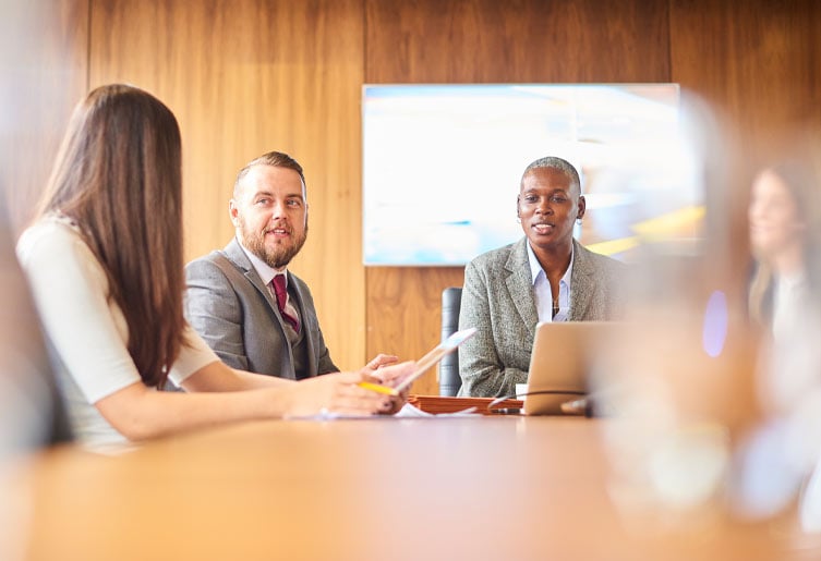 Employees sitting at a table