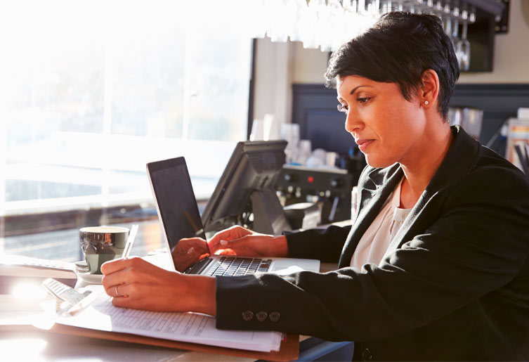 Woman in business clothes working at her desk