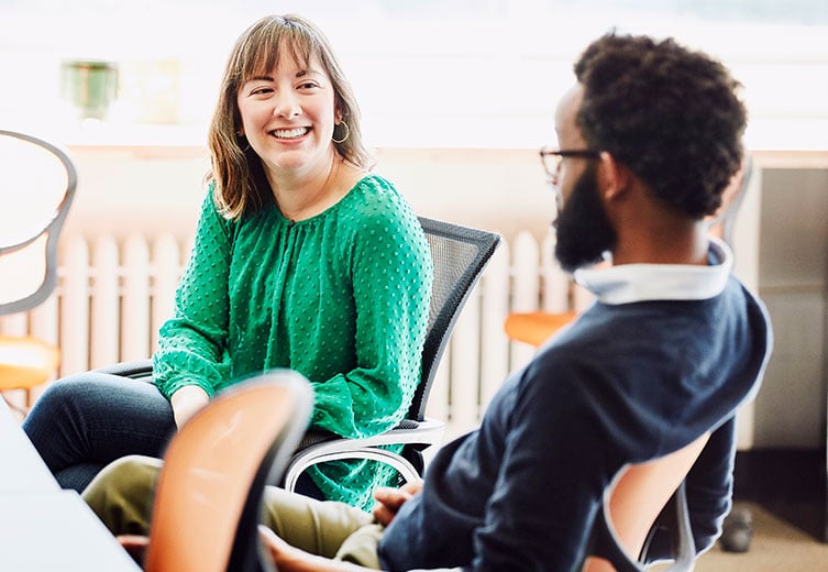 Man and woman sitting down talking