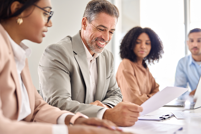 coworkers looking at paperwork together
