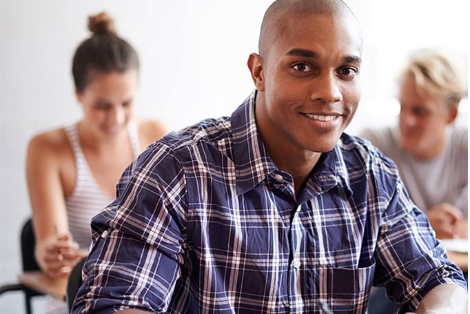 students sitting at a desk