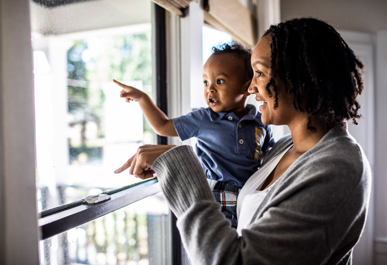 Mother and Son looking out the window