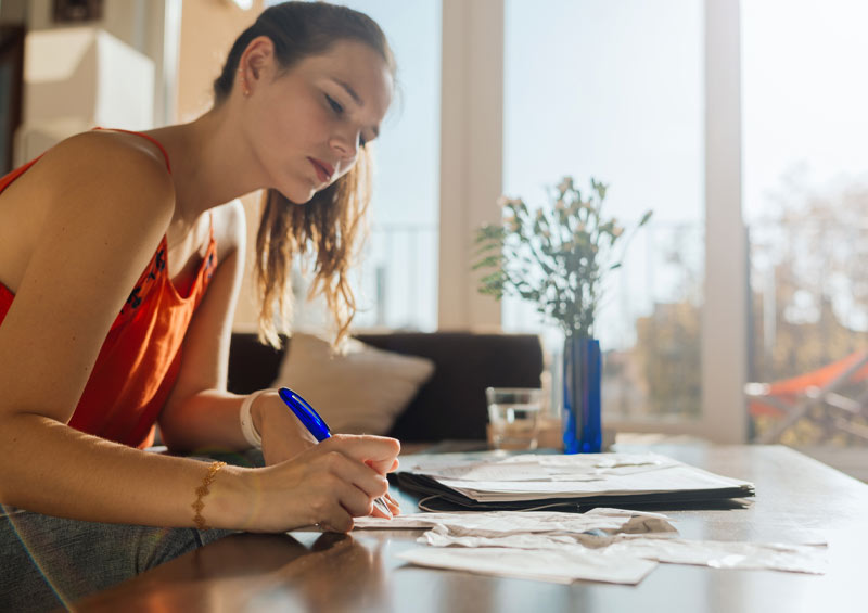 Woman looking through her receipts