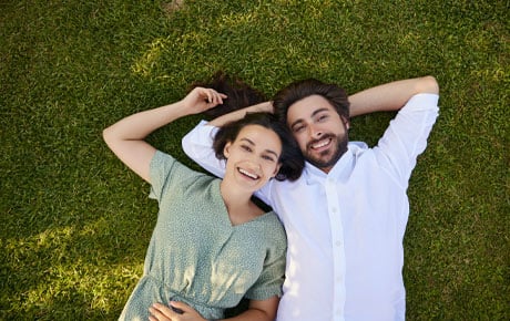 Couple laying in the grass