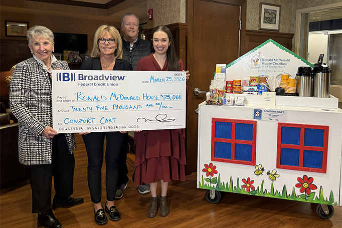 Kathy Lanni present check to Ronald McDonald House.