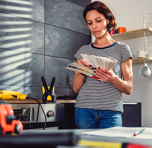 Woman looking at paint swatches