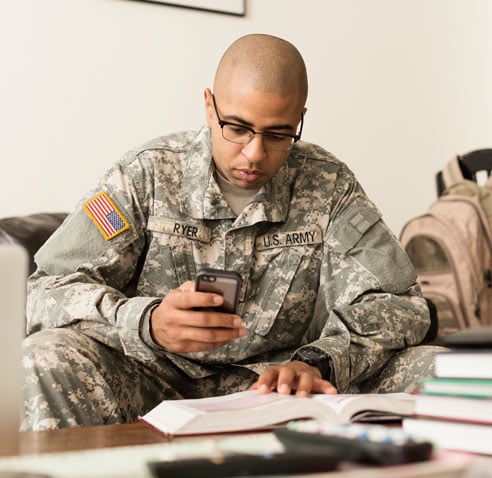 U.S Army personnel using mobile device 