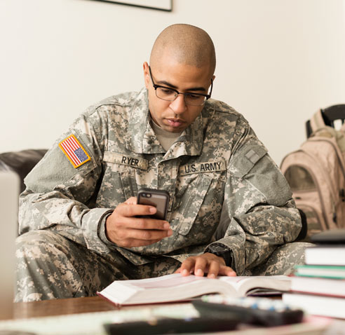 U.S Army personnel using mobile device