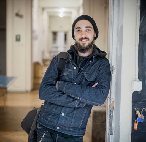 student standing against the door