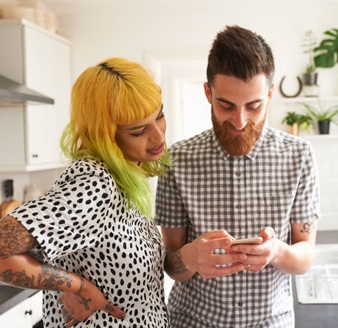 Couple looking at phone together