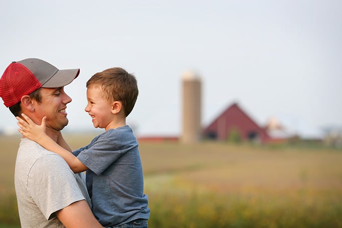 Father holding son