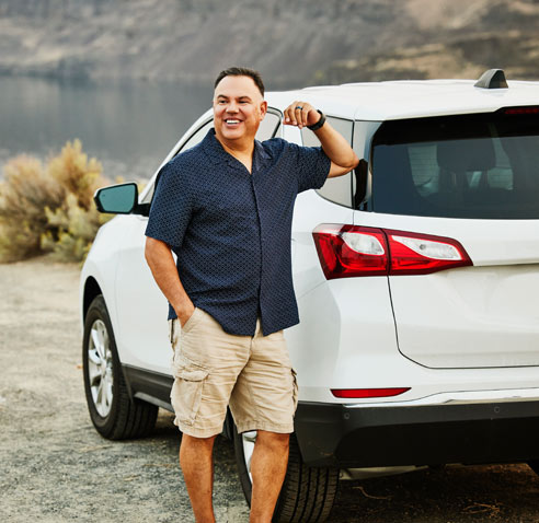 Man leaning on his car