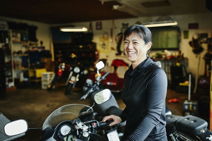 Woman sitting on motorcycle