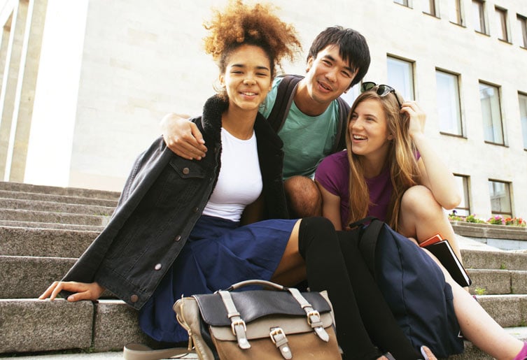 Students sitting together on steps