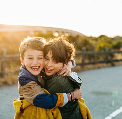 Two kids hugging