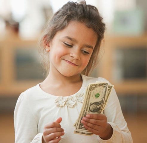 Girl holding money