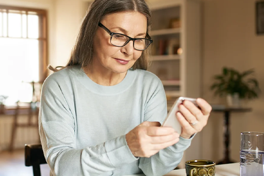 Woman checking text message on her phone.